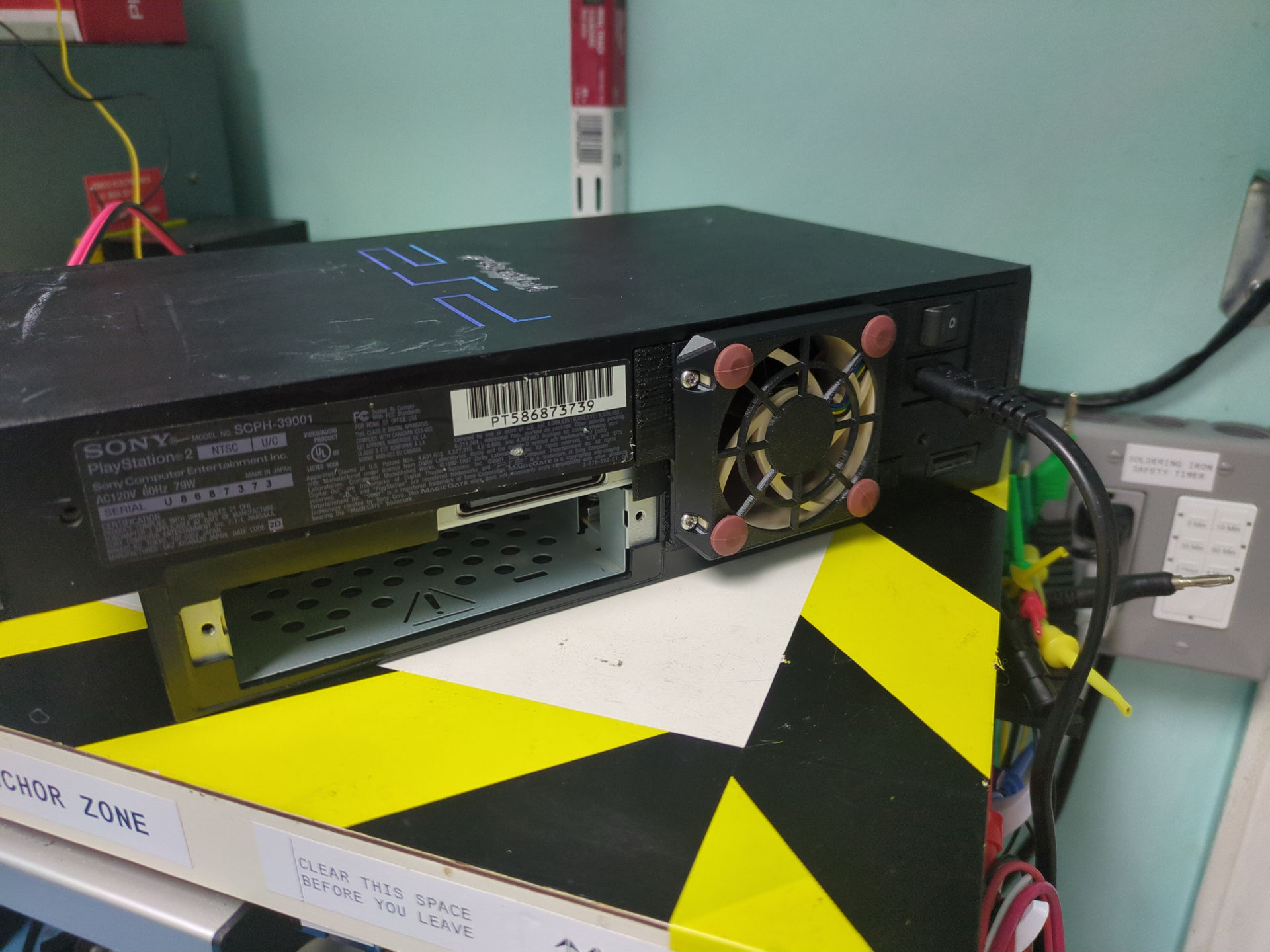 A PS2 fan-modded with a Noctua fan and 3D-printed bracket